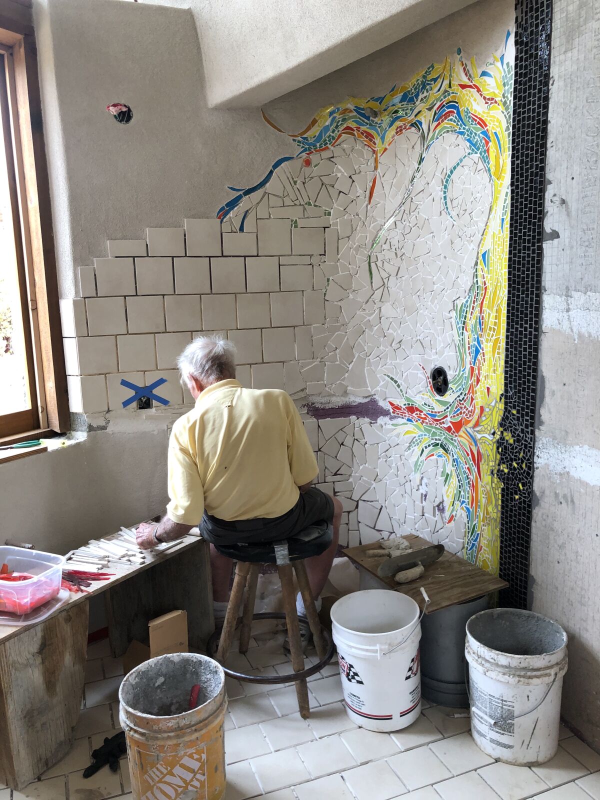 Artist James Hubbell, 89, works on a mosaic in the new caretaker's cottage at his Santa Ysabel compound. 