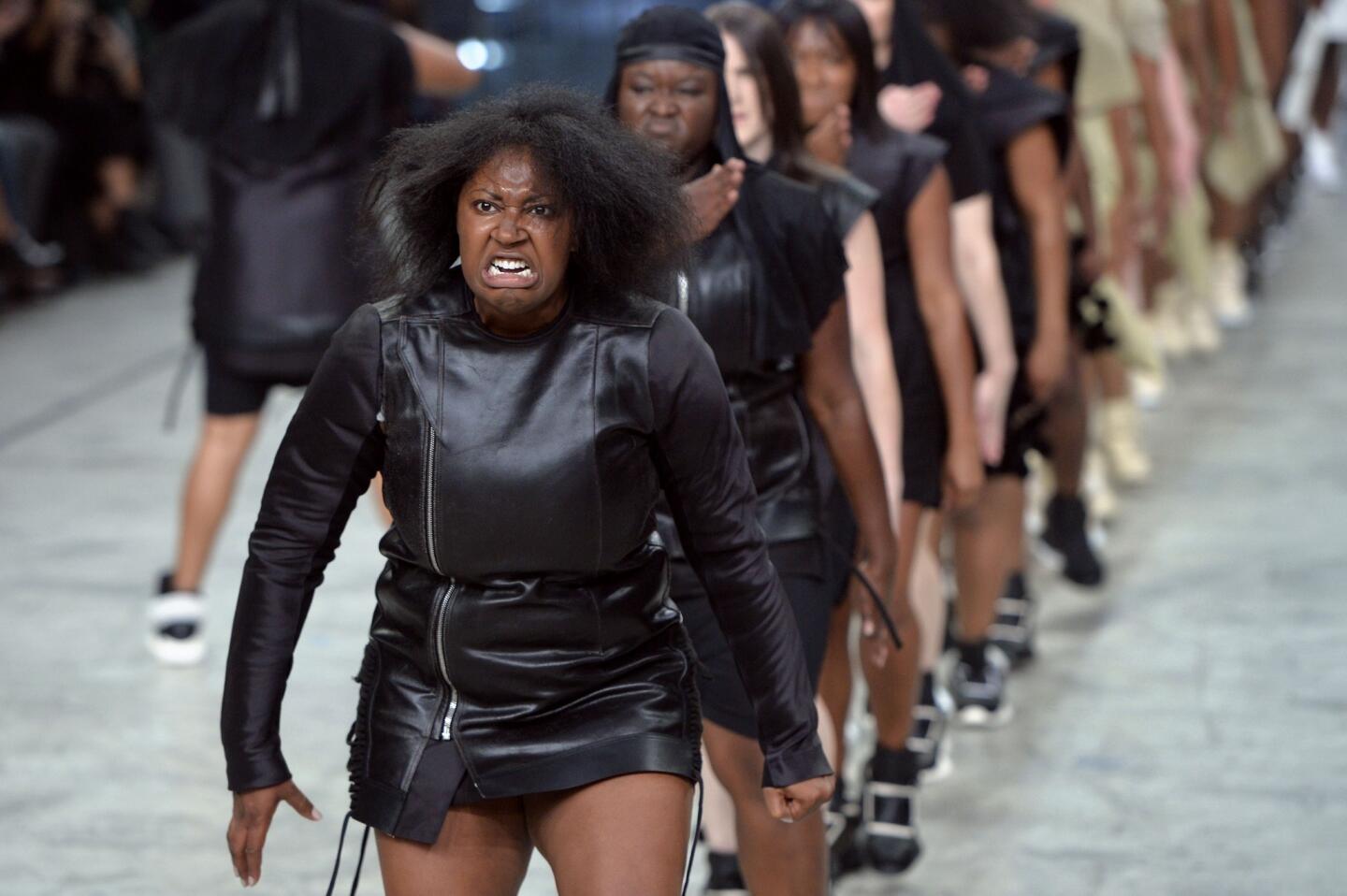 Models perform as they present creations by Rick Owens at spring/summer 2014 Paris Fashion Week.