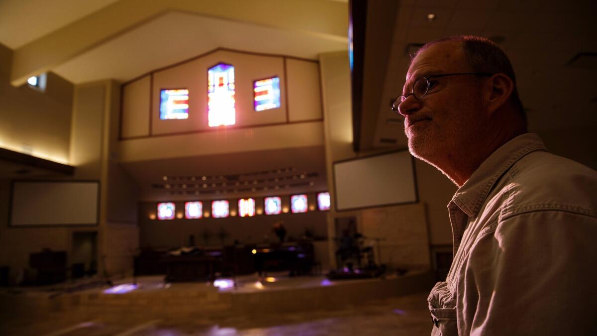 Senior pastor Jack Matkin leads the recovery effort as volunteers ready the main sanctuary space damaged by floodwaters.