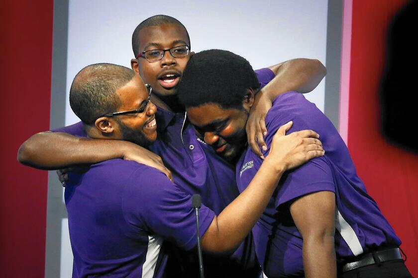 Brannon Billings, left, Chayse Lavallais and Joseph Dowell from Prairie View Agricultural and Mechnical University in Texas celebrate winning the Honda Campus All-Star Challenge.