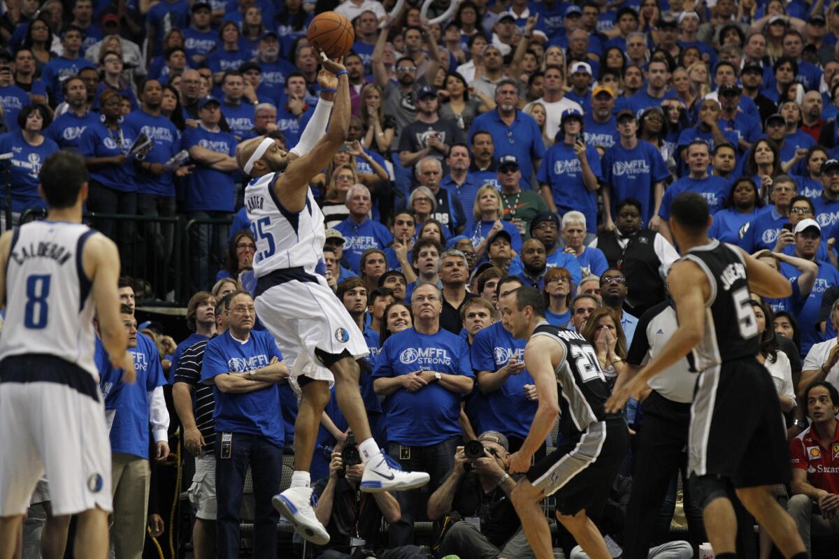 Dallas guard Vince Carter puts up the game-winning three-pointer at the buzzer to give the Mavericks a 109-108 victory over San Antonio on Saturday.