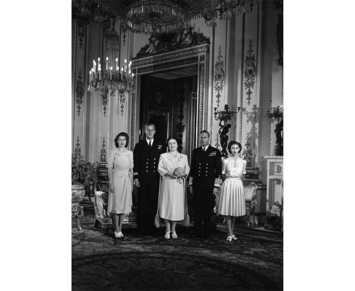 Jan. 1, 1947: King George VI and Queen Elizabeth pose with their daughter Princess Elizabeth, left, her fiance, Lt. Philip Mountbatten, and Princess Margaret in the White Drawing Room of Buckingham Palace, London.
