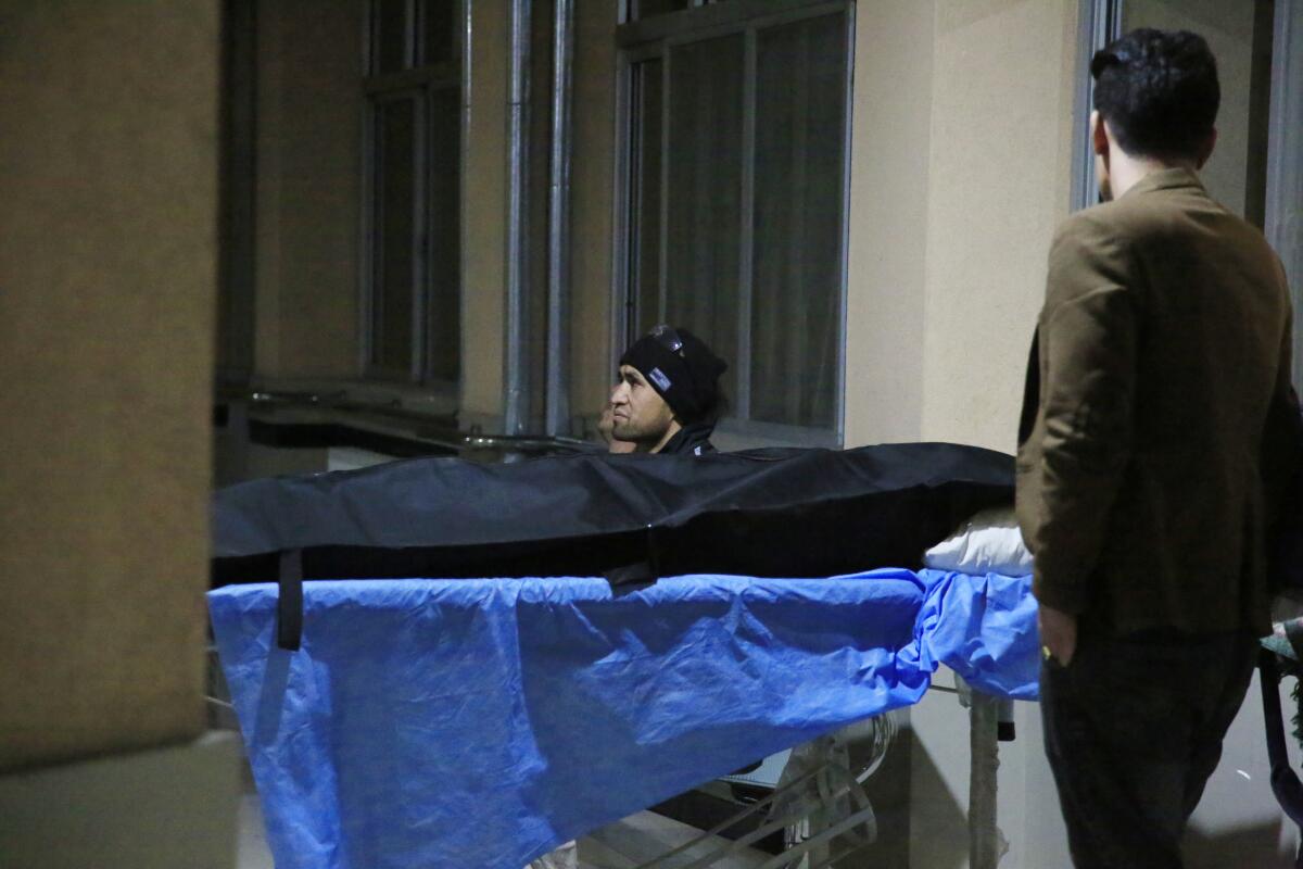 A body bag is seen outside a hospital in Kabul after a suicide attack 