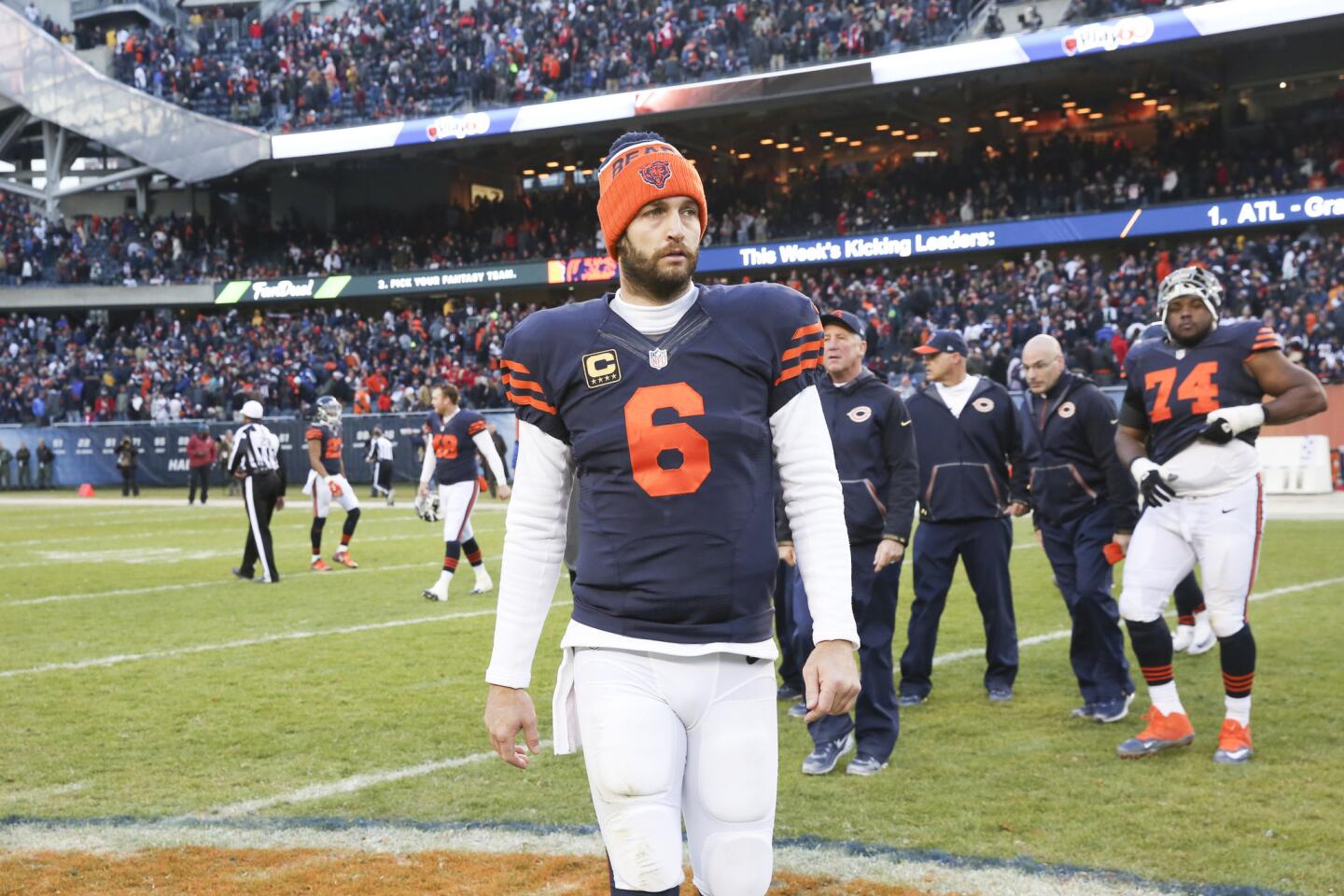 Jay Cutler walks off the field after the OT loss to the 49ers.