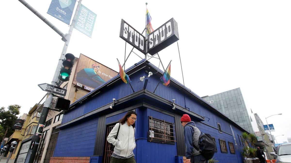 Pedestrians walk in front of The Stud bar in San Francisco on Wednesday.