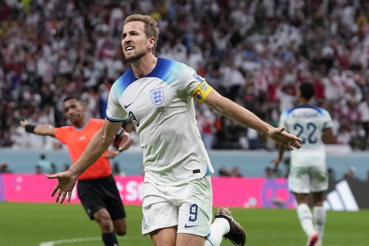 England's Harry Kane celebrates after scoring during a round-of-16 win over Senegal.
