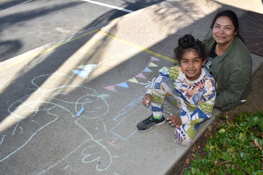 Ekaager Singh creating chalk art with his mother, Puneet Kaur.