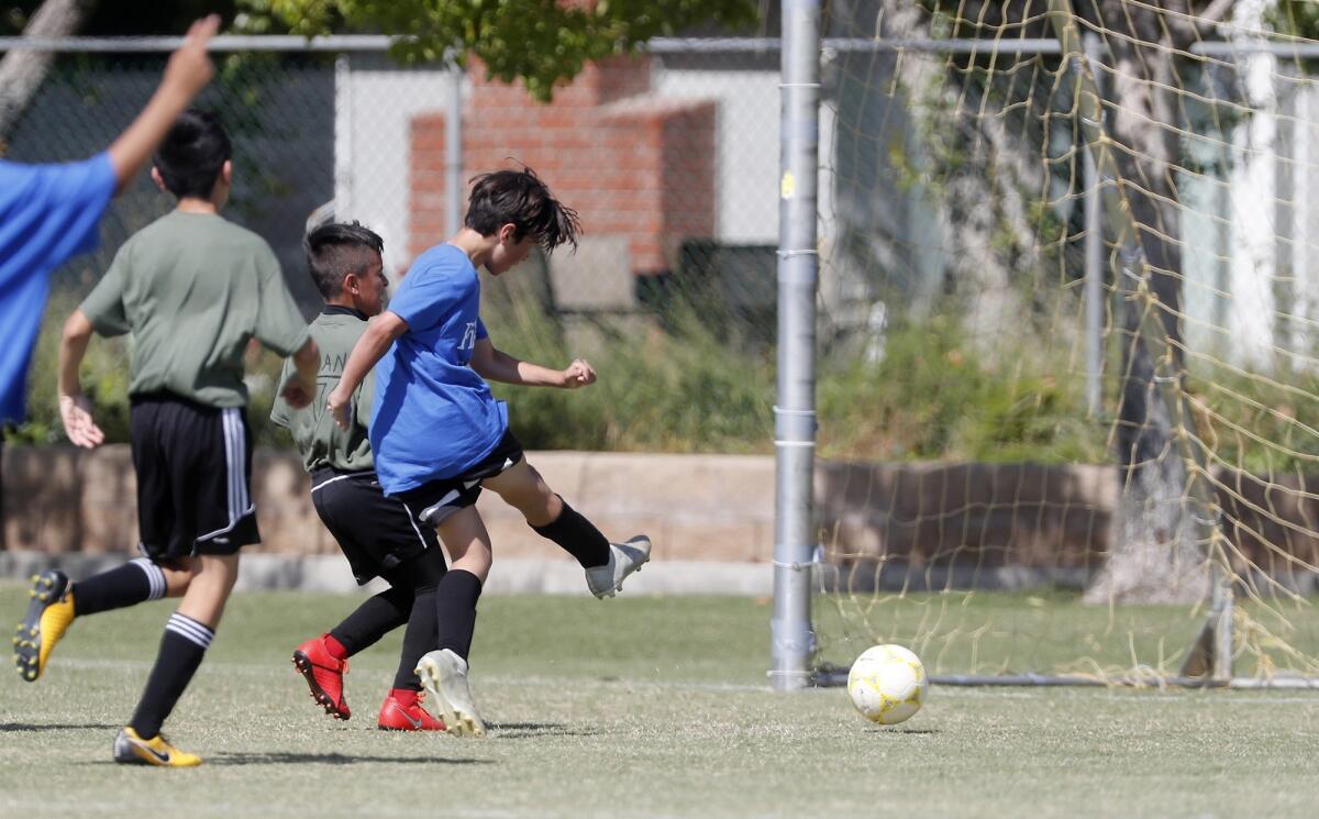 Lincoln Elementary's Rodrigo Fabregas scores a goal against Killybrooke during a boys’ fifth- and sixth-grade Gold Division pool-play match at the Daily Pilot Cup on Wednesday at Jack R. Hammett Sports Complex.