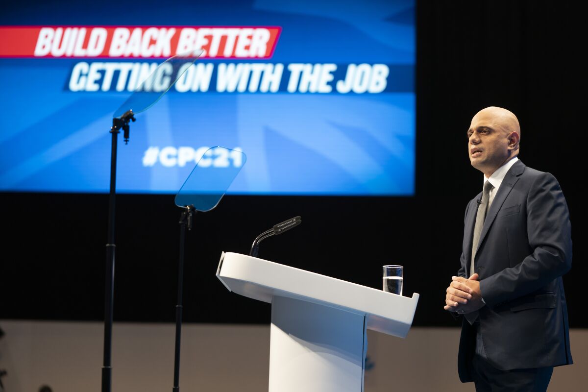 Sajid Javid, Secretary of State for Health and Social Care, speaks at the Conservative Party Conference in Manchester, England, Tuesday, Oct. 5, 2021. (AP Photo/Jon Super)