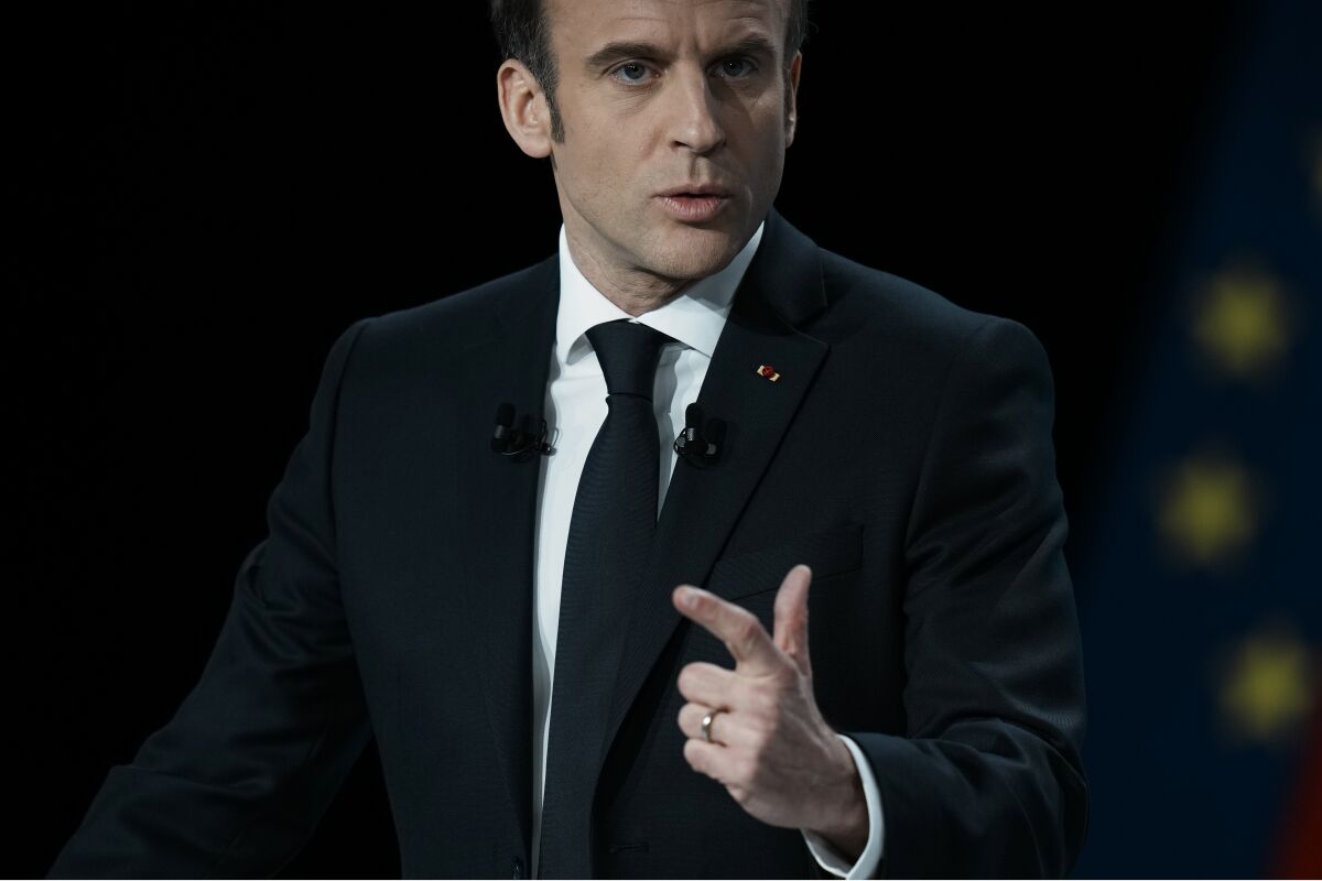 French President Emmanuel Macron arrives on stage for a presidential campaign news conference in Aubervilliers, north of Paris, France, Thursday, March 17, 2022. Even though he formally announced he is running for a second term at the beginning of the month, Macron has not held any rallies yet. The two-round presidential election will take place on April 10 and 24, 2022. (AP Photo/Thibault Camus)