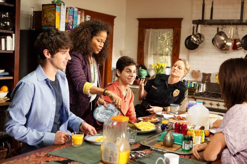 David Lambert, left, Sherri Saum, Jake T. Austin and Teri Polo in "The Fosters" on ABC Family.