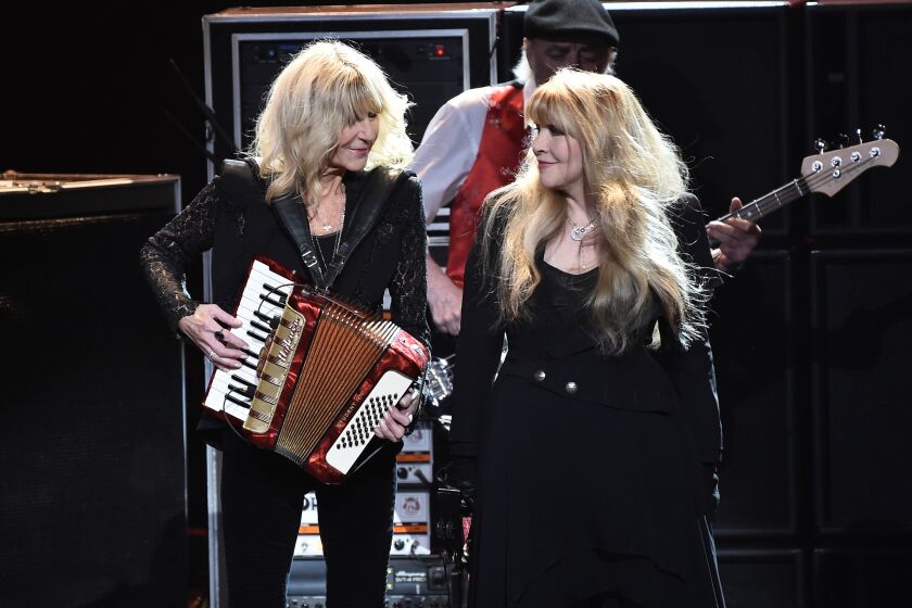 Christine McVie (L) and Stevie Nicks perform onstage during MusiCares Person of the Year honoring Fleetwood Mac