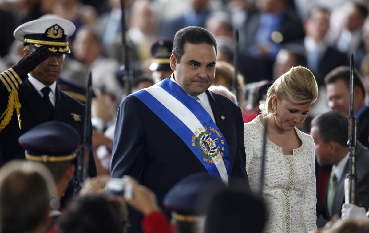 Former El Salvador President Tony Saca and his wife, Ana Ligia de Saca, arrive at the 2009 inauguration ceremony for Mauricio Funes in San Salvador. Funes and a third former president are also being investigated.