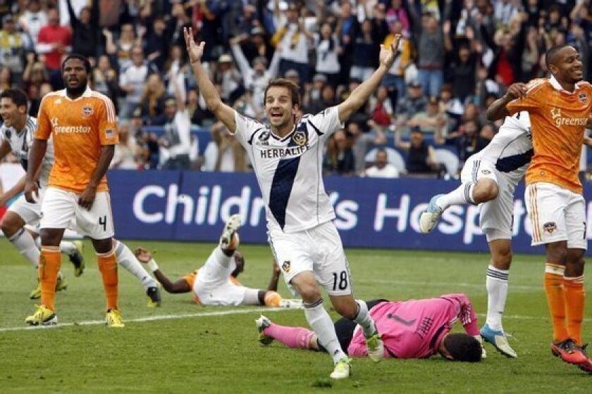 Mike Magee signed to play another season for the Galaxy.