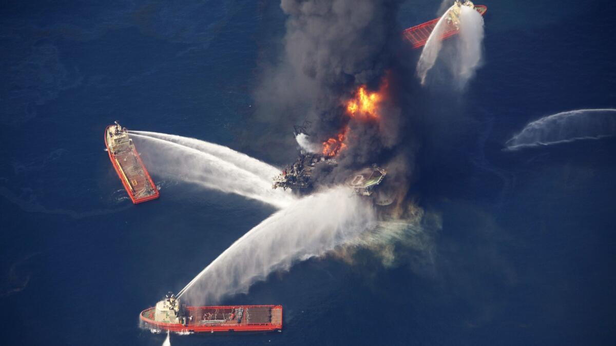 The Deepwater Horizon oil rig, aflame in the Gulf of Mexico in 2010. The rig's owner, BP, is one of more than 20 oil companies being sued over their alleged role in climate change.
