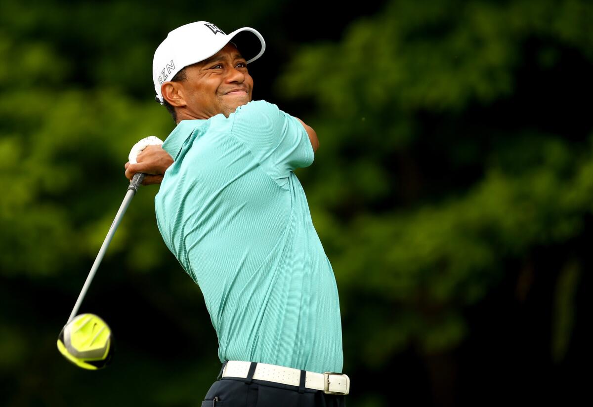 Tiger Woods tees off during the first round of the Greenbrier Classic at the Old White TPC on Thursday.