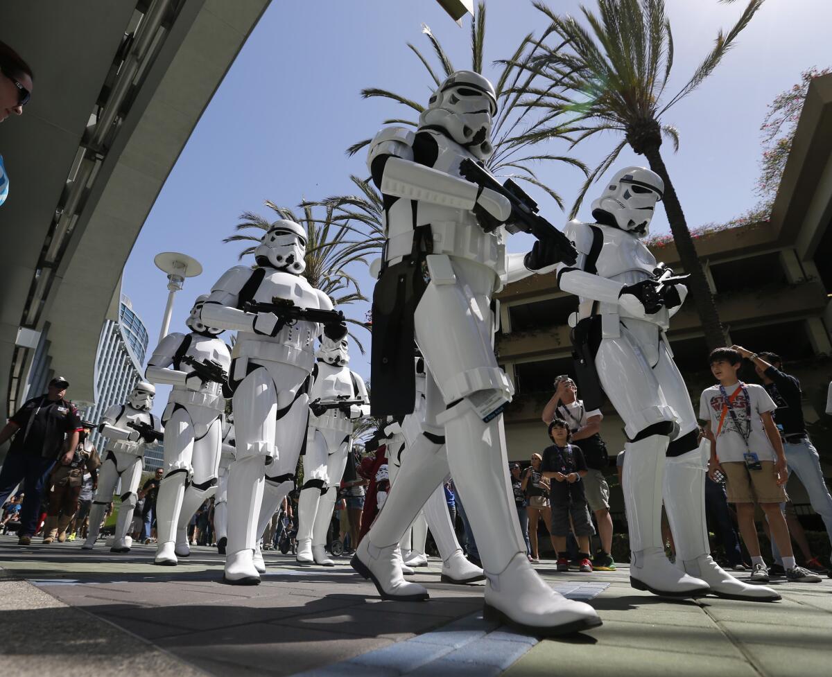 Stormtroopers join a parade of "Star Wars" characters from the worldwide 501st Legion costume organization as they make a dramatic entrance into the Star Wars Celebration at the Anaheim Convention Center on April 16.