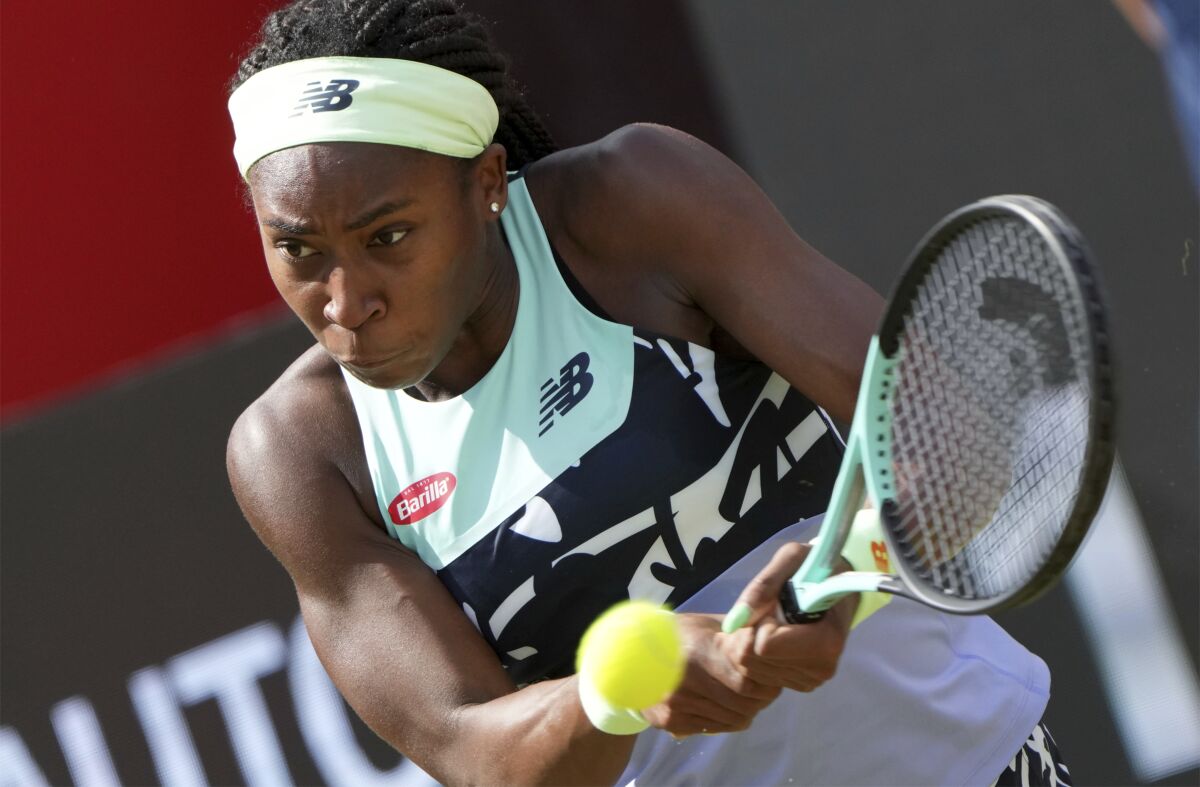 Coco Gauff from the United States returns the ball to Wang Xinyu from China during their WTA tournament round of sixteen tennis match in Berlin, Germany, Thursday, June 16, 2022. (AP Photo/Michael Sohn)