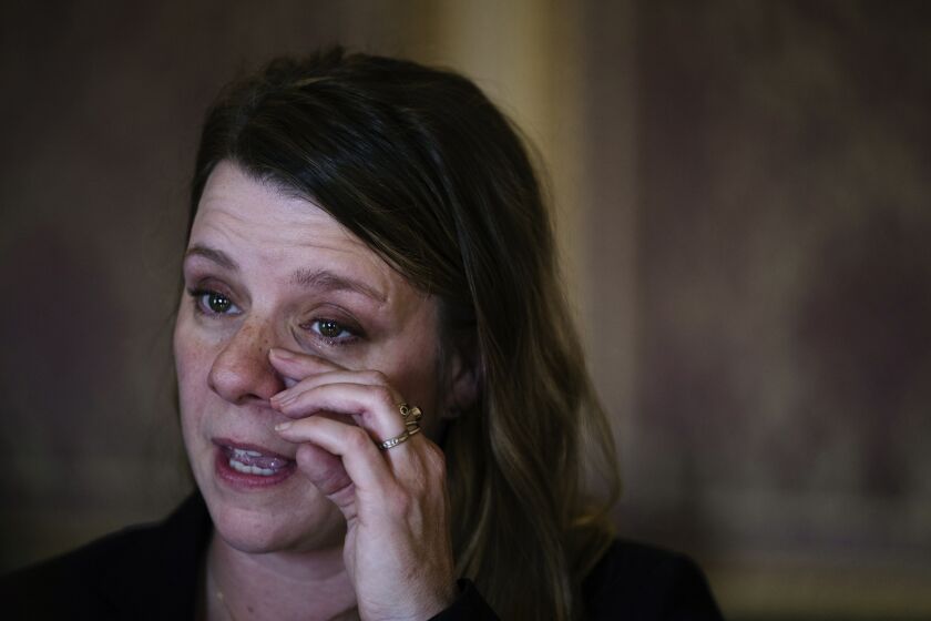 Nicole Schmidt, mother of Gabby Petito, wipes away a tear during a press conference for SB117, a bill advocating for domestic violence protections, at the Capitol in Salt Lake City on Monday, Jan. 30, 2023. (Ryan Sun/The Deseret News via AP)