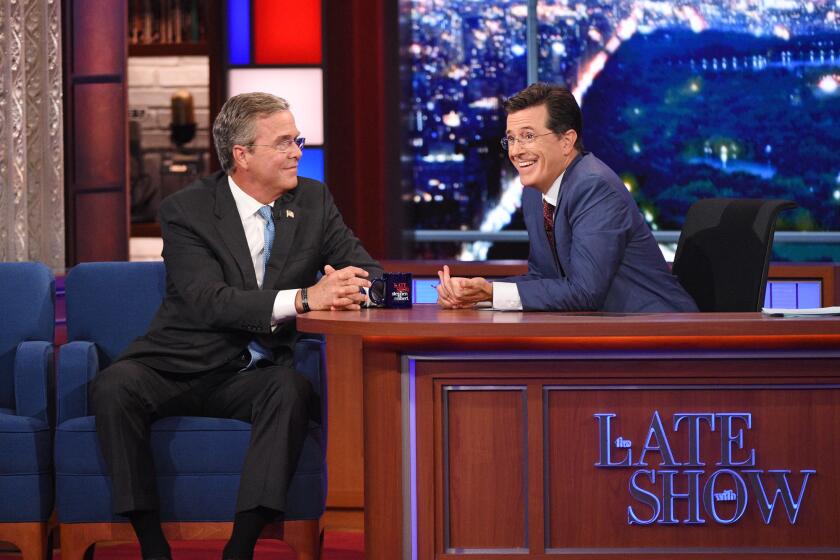 Stephen Colbert talks with Jeb Bush during the premiere episode of "The Late Show" on Sept. 8.