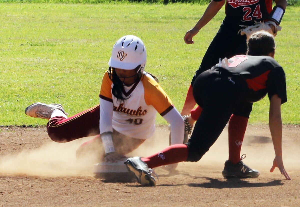 Ocean View's Kaya Collado (40) slides safe into second base against Garden Grove on Friday in a Golden West League game.