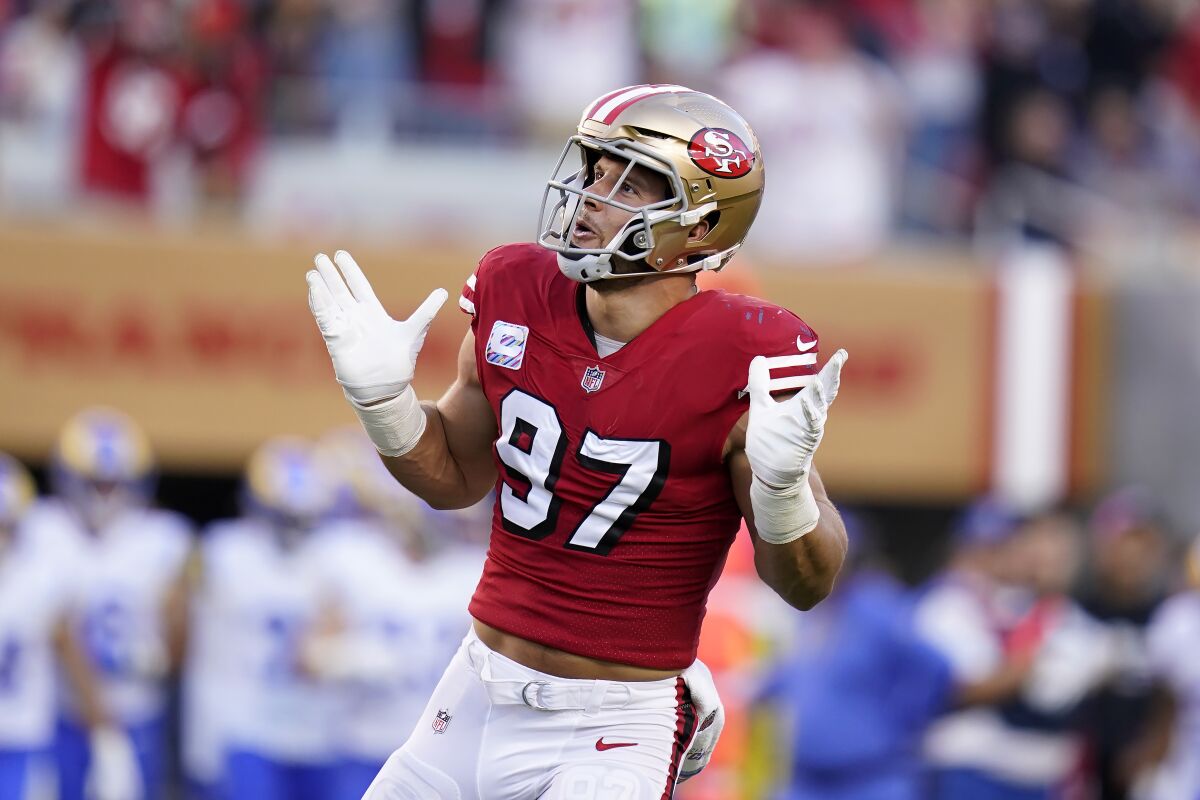 San Francisco 49ers defensive end Nick Bosa (97) reacts after sacking Los Angeles Rams quarterback Matthew Stafford during the first half of an NFL football game in Santa Clara, Calif., Monday, Oct. 3, 2022. (AP Photo/Godofredo A. Vásquez)