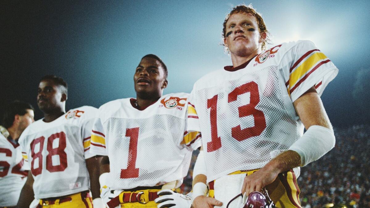 Todd Marinovich (13), quarterback for the USC Trojans and wide receiver John Jackson (1) during the 76th Rose Bowl against the University of Michigan on Jan. 1, 1990