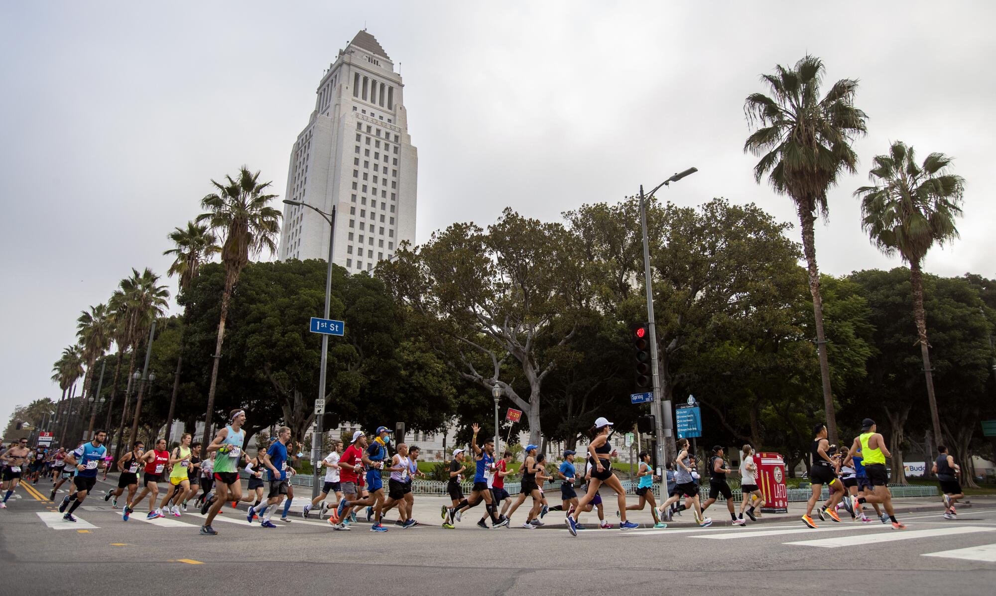Runners make the turn onto 1st Street near City Hall at the three-mile mark.
