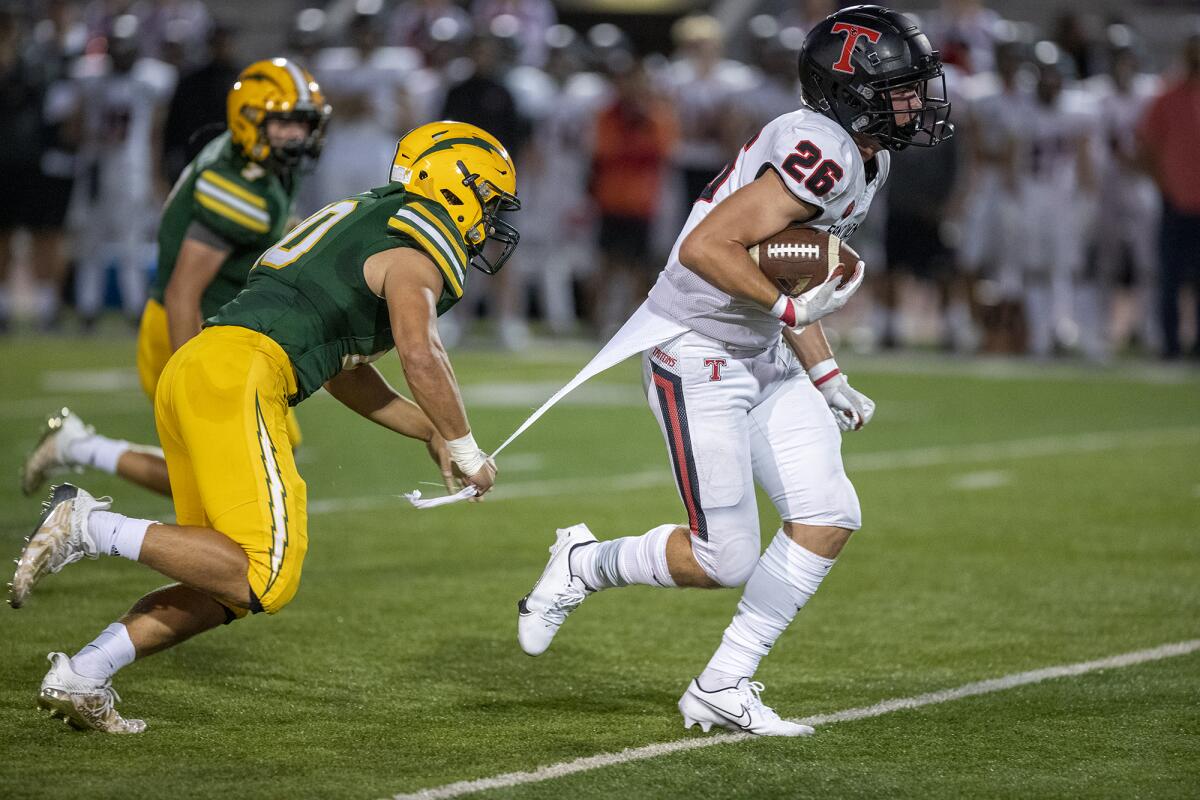 Edison's Peyton Gregory grabs a shirt of San Clemente's Brock Della Vedova.