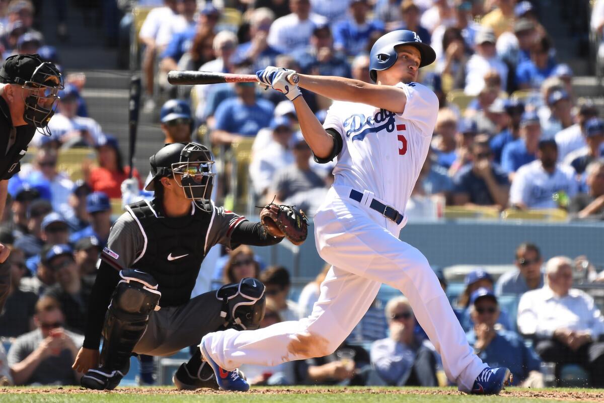 Dodgers Corey Seager hits a solo home run against Diamondbacks pitcher Zank Greinke in the 4th inning at Dodger Stadium.