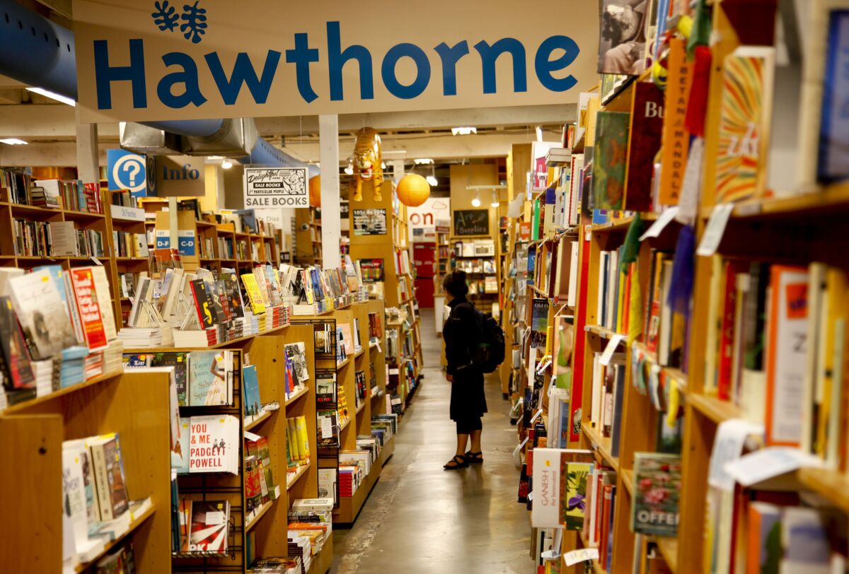 A customer browses the shelves at Powell's Books in 2013.