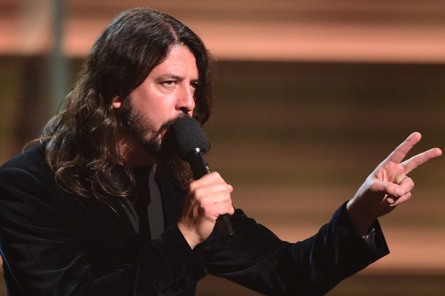 Musician Dave Grohl takes the stage.