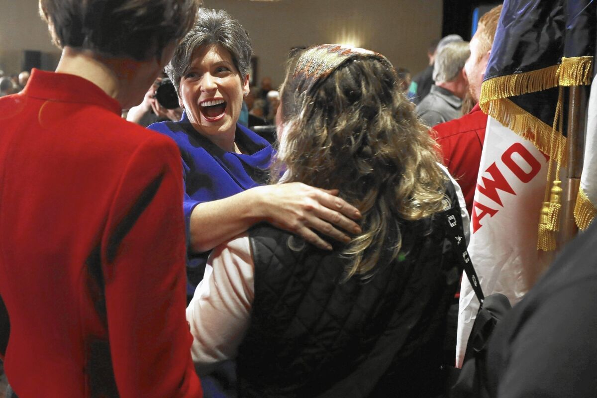 Republican Joni Ernst of Iowa celebrates her victorious Senate campaign on election night. She defeated her Democratic opponent by an 8-percentage-point margin.