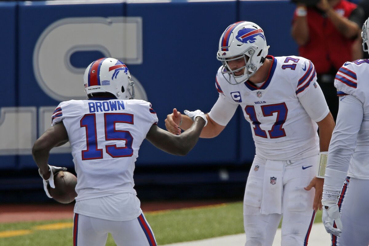 Buffalo Bills wide receiver John Brown (15) celebrates with quarterback Josh Allen after they connected on a pass play for a touchdown during the first half of an NFL football game against the New York Jets in Orchard Park, N.Y., Sunday, Sept. 13, 2020. (AP Photo/Jeffrey T. Barnes)