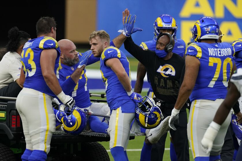 Los Angeles Rams offensive tackle Andrew Whitworth (77) is carted off the field after an injury during an NFL football game against the Seattle Seahawks Sunday, Nov. 15, 2020, in Inglewood, Calif. (AP Photo/Ashley Landis)