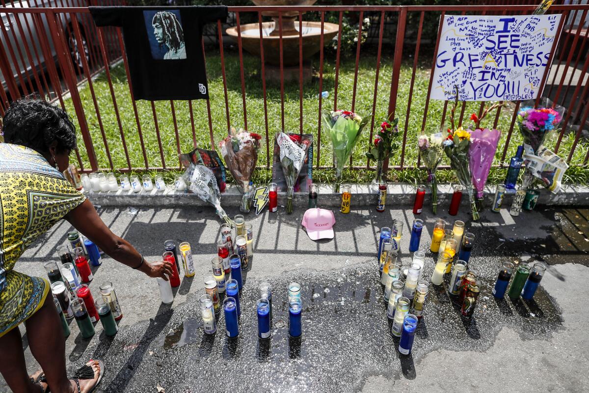 A small shrine was forming in in the parking lot outside.