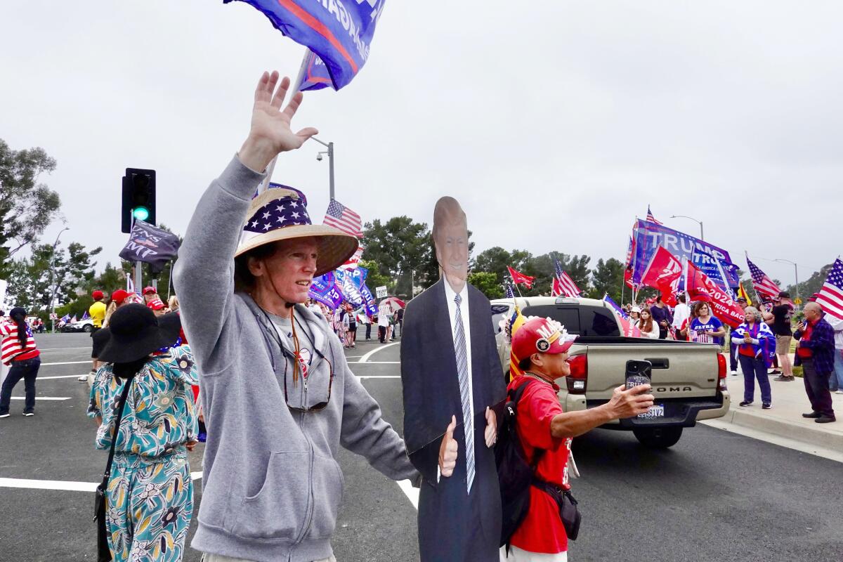 Trump supporters in Newport Beach on Saturday.