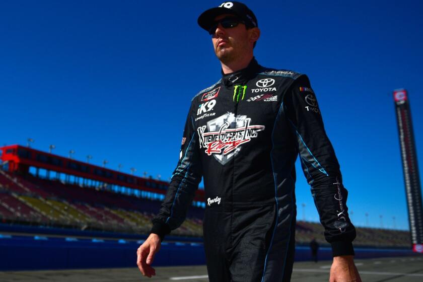 FONTANA, CA - MARCH 16: Kyle Busch, driver of the #18 iK9 Toyota, walks on the grid during qualifying for the NASCAR Xfinity Series Production Alliance Group 300 at Auto Club Speedway on March 16, 2019 in Fontana, California. (Photo by Jared C. Tilton/Getty Images) ** OUTS - ELSENT, FPG, CM - OUTS * NM, PH, VA if sourced by CT, LA or MoD **