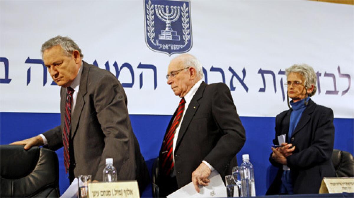 WORK DONE: Three members of the commission that reported on Israel¡¦s 2006 war in Lebanon ¡X retired Gen. ©Menachem ©Einan, left; Eliyahu Winograd, the ex-judge who chaired the panel; and law professor Ruth ©Gavison ¡X leave a Jerusalem news conference.