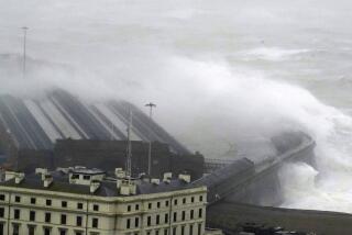 Waves crash over the harbour wall as Storm Ciaran brings high winds and heavy rain along the south coast of England, in Folkestone, Thursday, Nov. 2, 2023. Winds up to 180 kilometers per hour (108 mph) slammed France's Atlantic coast overnight as Storm Ciaran lashed countries around western Europe, uprooting trees, blowing out windows and leaving 1.2 million French households without electricity Thursday. Strong winds and rain also battered southern England and the Channel Islands, where gusts of more than 160 kph (100 mph) were reported. (Gareth Fuller/PA via AP)