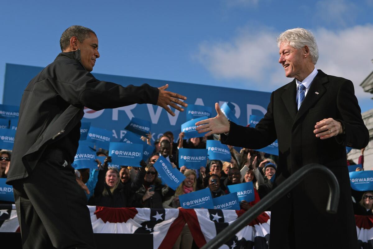 A comparison of presidents: Bill Clinton is popular and President Obama is far less so in a new Wall Street Journal poll. Above, the two campaigned together in Concord, N.H., in 2012.