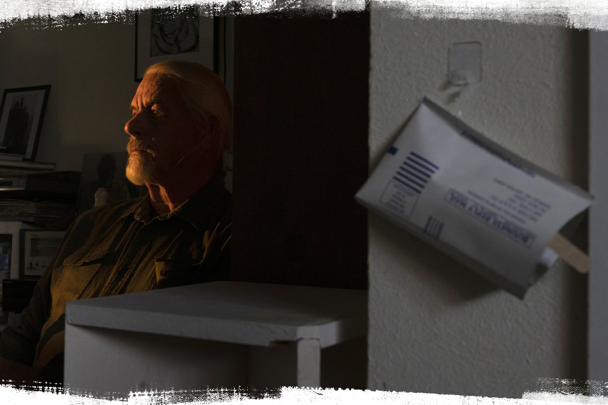 Portrait of John Boomer next to a radon test.
