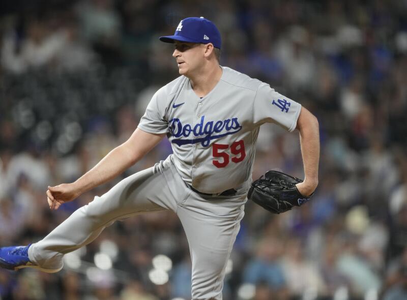 Los Angeles Dodgers relief pitcher Evan Phillips throws against the Colorado Rockies.