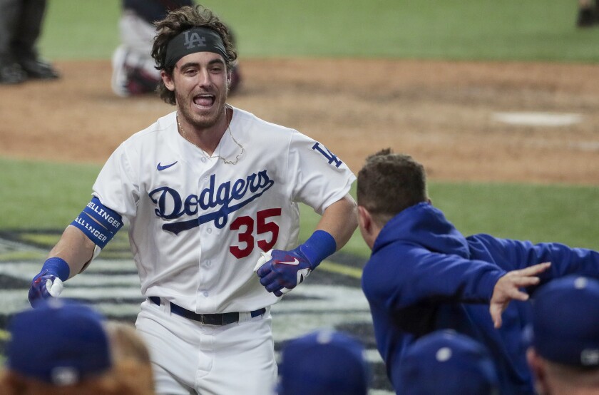 Dodgers center fielder Cody Bellinger celebrates after hitting a home run in the playoffs.