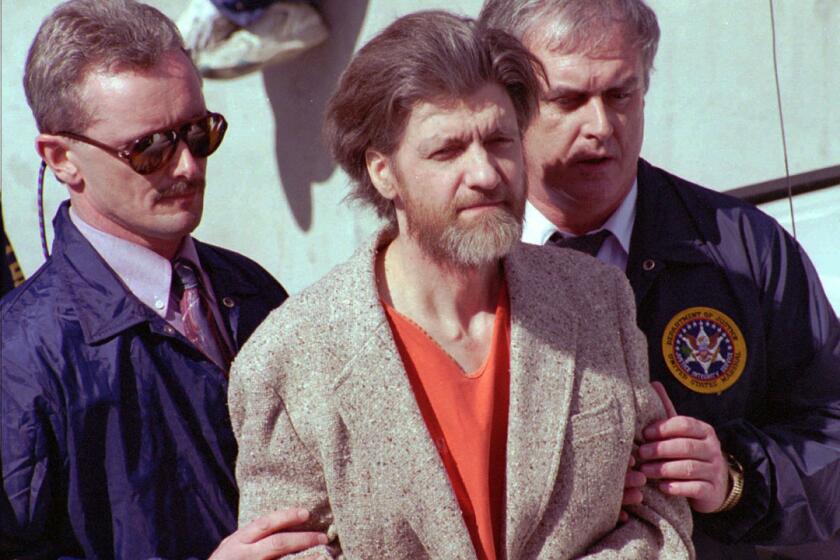 Unabomber Theodore Kaczynski was given four life sentences plus 30 years by a federal judge in Sacramento under a plea agreement that spared him the death penalty. Above, Kaczynski is let to a courthouse in Montana in 1996.