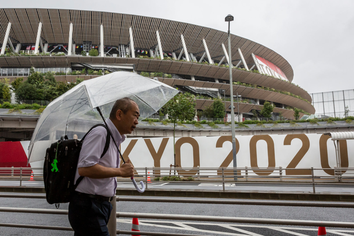 A man walks past Olympic Stadium in Tokyo on Tuesday.