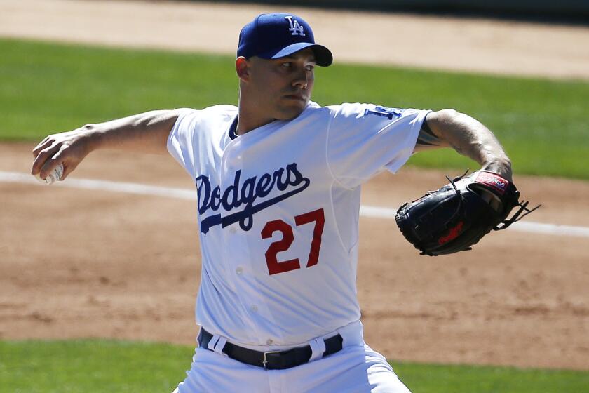 Dodgers reliever Dustin McGowan pitches during an exhibition game against the Seattle Mariners on March 6.