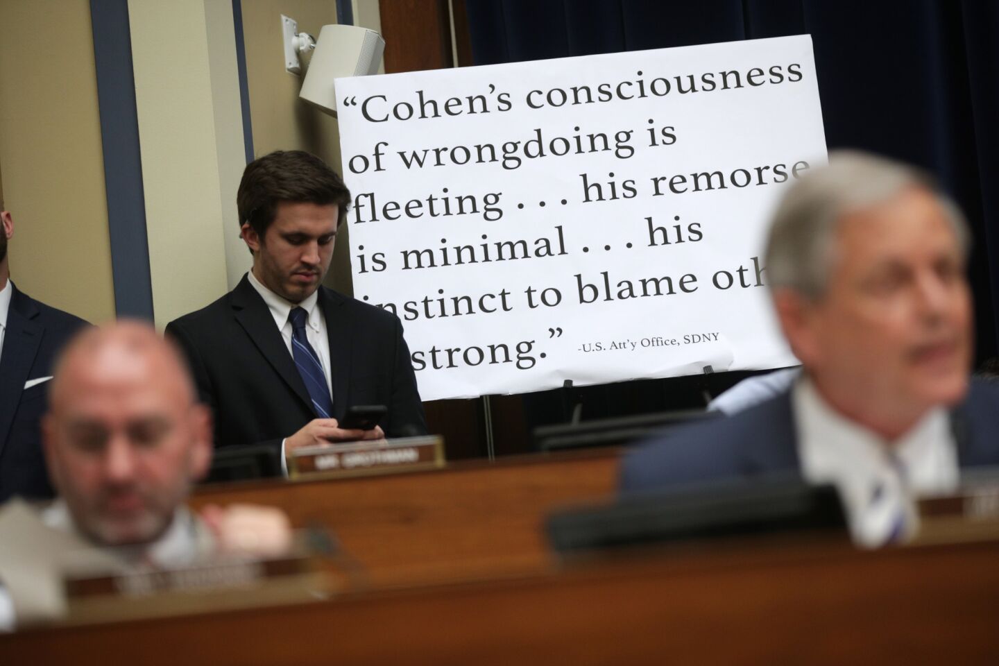A quote about Michael Cohen, attributed to the U.S. Attorney's Office, is put on display during testimony before the House Oversight Committee on Capitol Hill February 27, 2019 in Washington, DC.