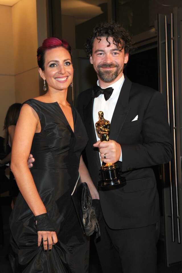 Henning and his wife arrive at the party after his win for visual effects, for "Hugo."