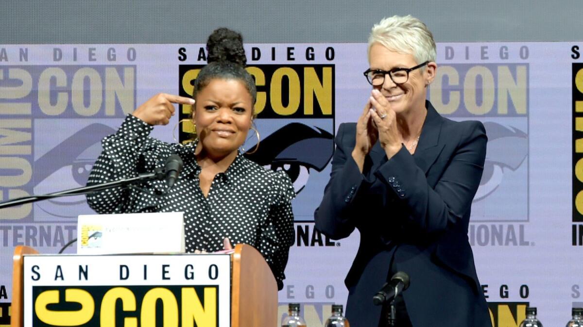 Yvette Nicole Brown, left, and Jamie Lee Curtis onstage at Universal Pictures' "Halloween" panel during Comic-Con International 2018.
